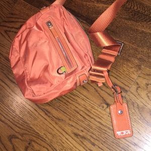 Orange tumi purse